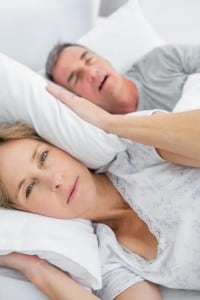 couple suffering from the health risks of snoring