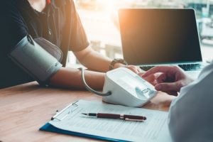 patient getting blood pressure taken